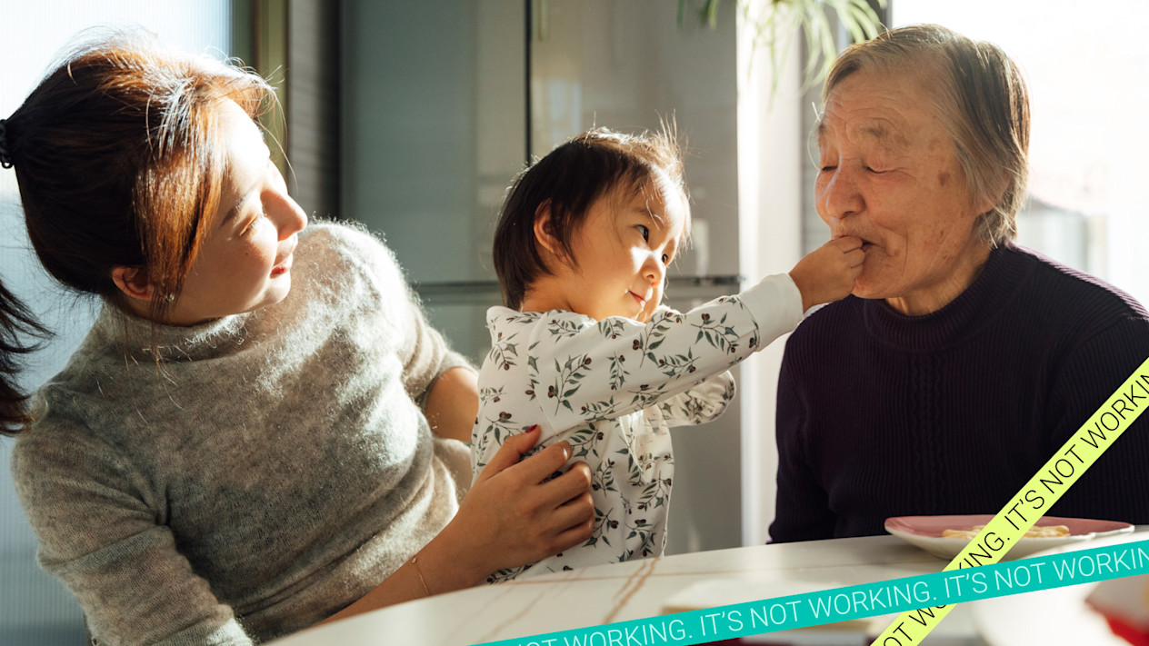 Millennial woman sits with toddler and elderly woman at kitchen table. Millennials have aged into the sandwich generation, and caregiving can threaten their financial futures. 