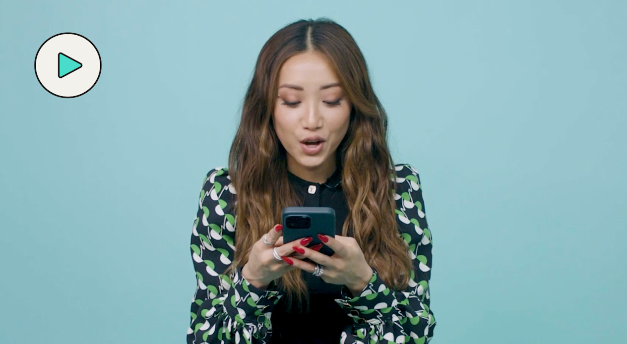 Brenda Song texting with theskimm 