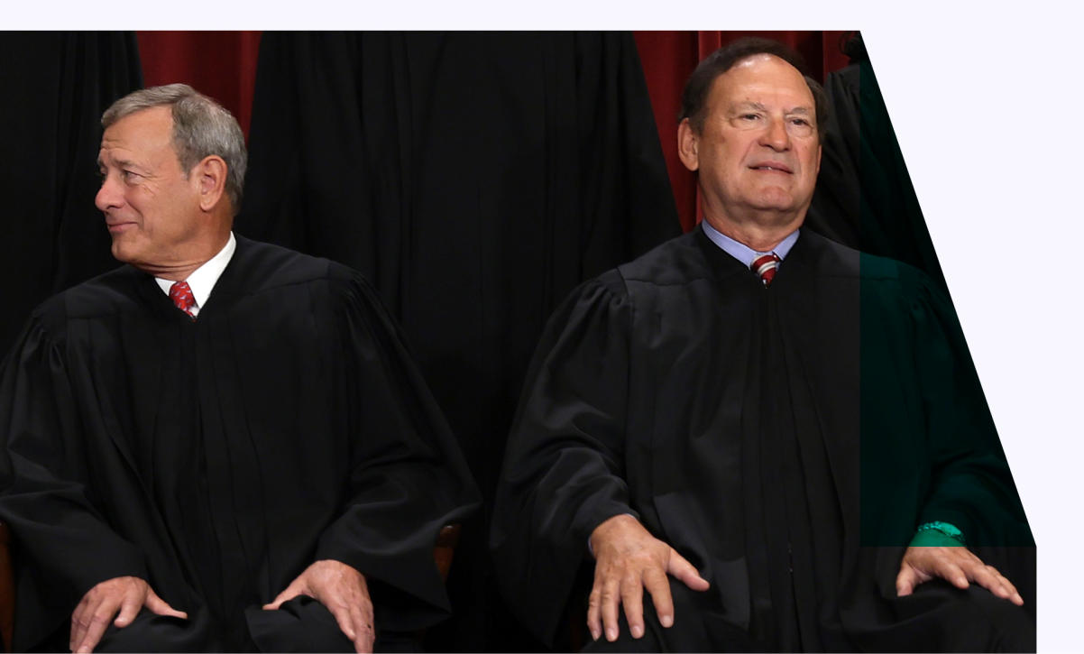 United States Supreme Court Chief Justice John Roberts (L) and Associate Justice Samuel Alito (R) pose for an official portrait 