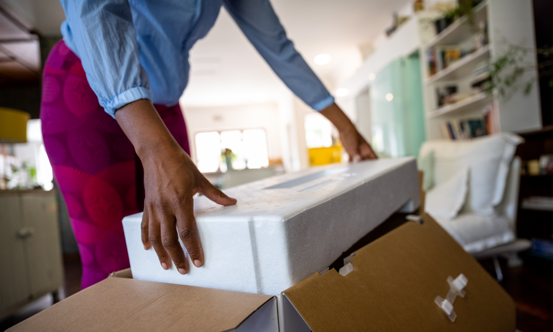 Woman unpacking a box